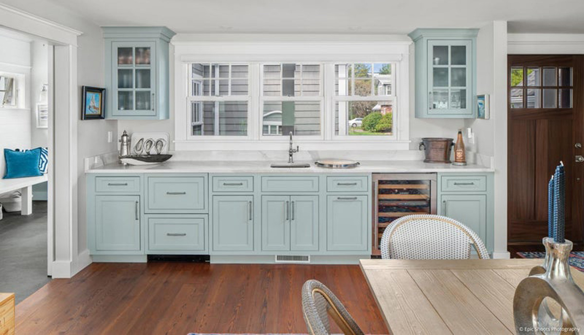 Elegant Kolbe Ultra Series double-hung window in a luxury Sarasota kitchen. It features a pine interior primed for on-site finishing, 7/8" performance divided lites for a classic look, and sophisticated Satin Nickel hardware. The window floods the high-end space with natural light, showcasing Kolbe’s' commitment to quality and style in coastal homes.